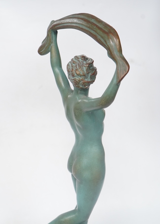 A French Art Deco bronze model of a dancer, green patination, on black marble base. 33cm high. Condition - minor chip to base